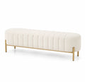Banco de tela beige con estructura de metal dorado